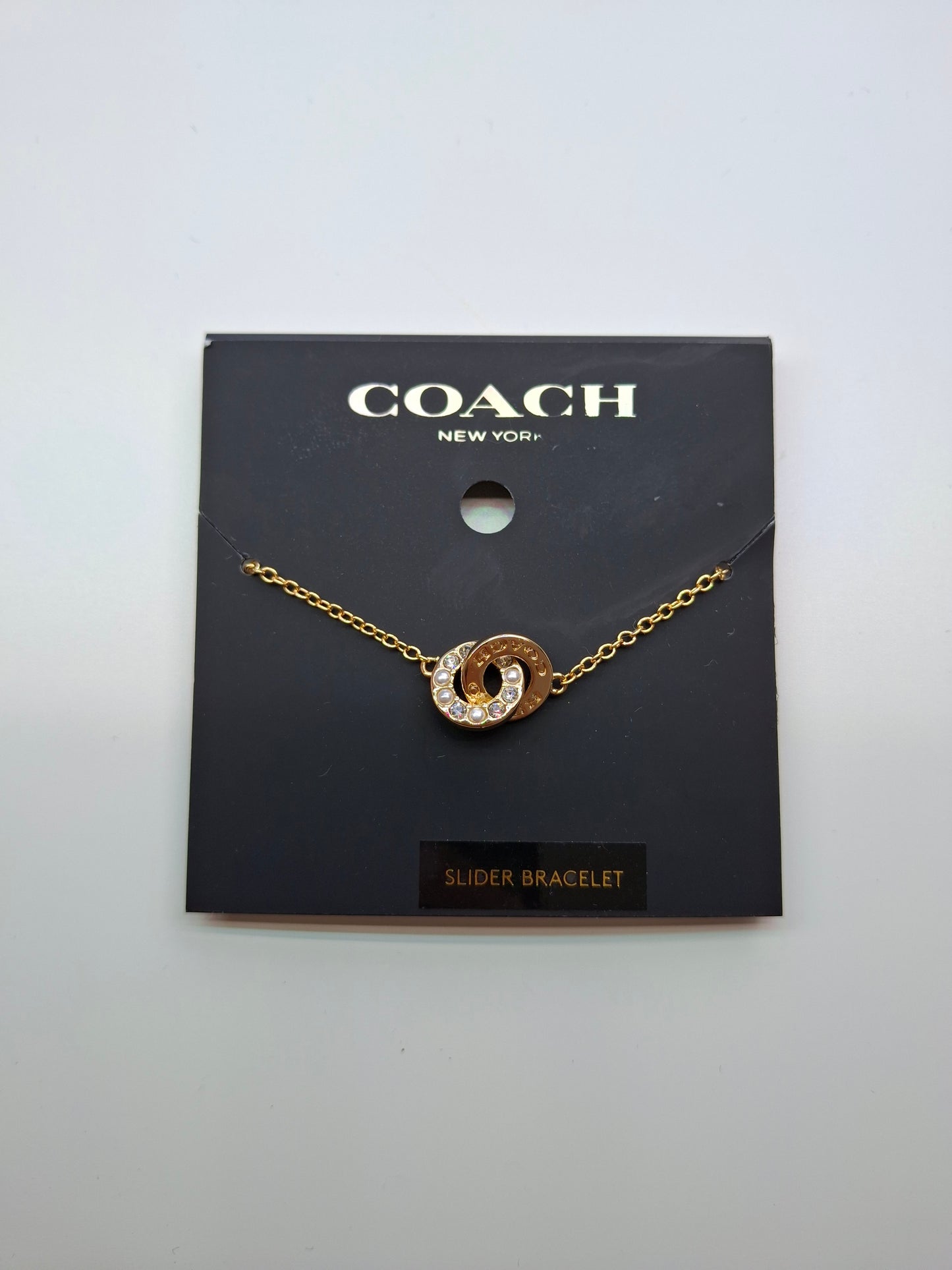 Brazalete Coach